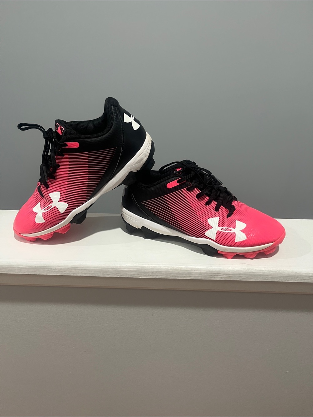 Under Armour Girls Pink and Black Softball Cleats Size 3 1/2 used half a season